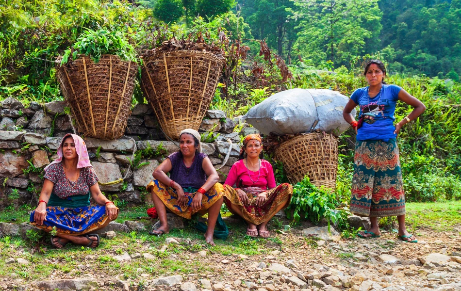 Local village women from Nagarkot Nepal resting with basket of grass 