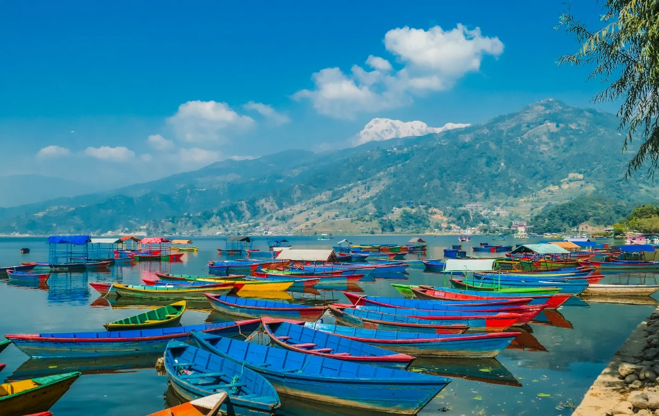 Beautiful view of Fewa Lake with colorful boats in Pokhara
