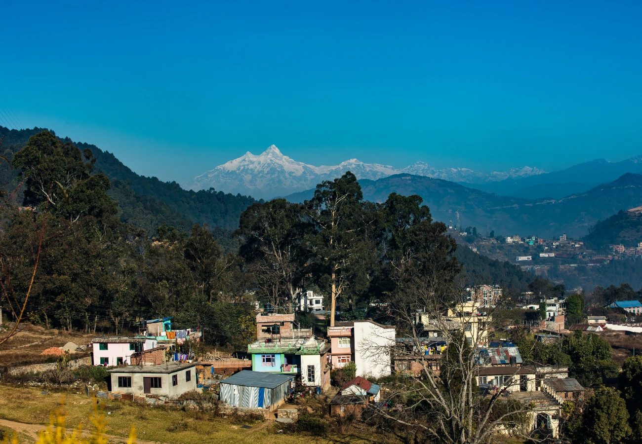 Beautifl view of picturesque village with stunning mountain range while hiking to Chandragiri.