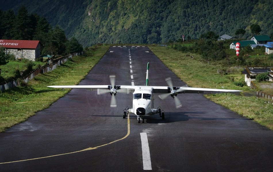 Airplane landing in the Tenzing Hillary Airport after the flight from Kathmandu to Lukla in Everest Base Camp Trek